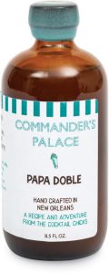 brown bottle with white and turquoise label that reads Commander's Palace Papa Doble